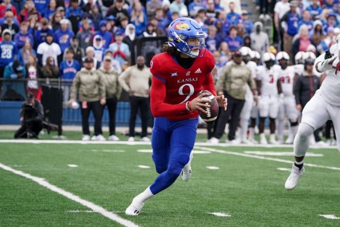 Nov 11, 2023; Lawrence, Kansas, USA; Kansas Jayhawks quarterback Jason Bean (9) drops back to pass against the Texas Tech Red Raiders during the first half at David Booth Kansas Memorial Stadium. Mandatory Credit: Denny Medley-USA TODAY Sports